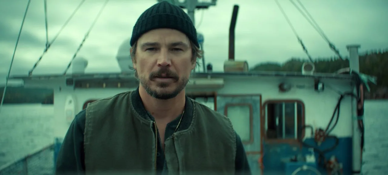 Josh Hartnett as fisherman Calvin Penney on the deck of his boat in Netflix's Below