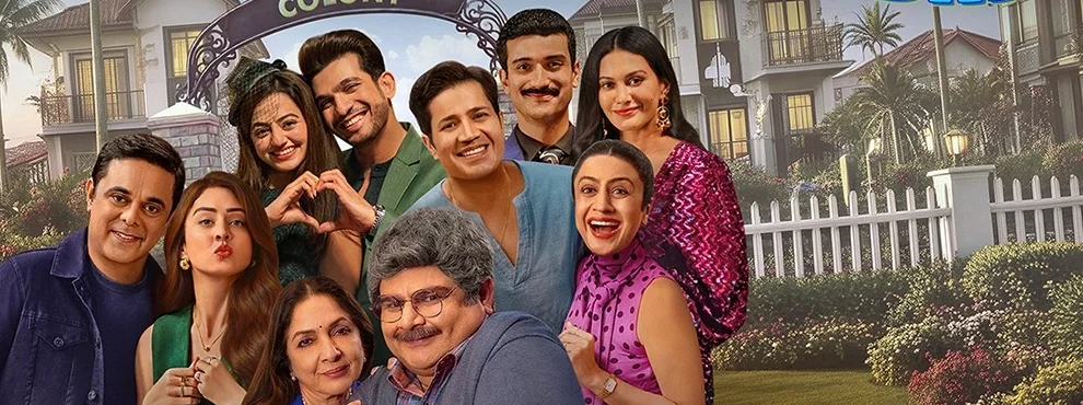 The Chumbak cast posing together outside the Chumbak Colony gate, with Neena Gupta and Deven Bhojani seated at the front