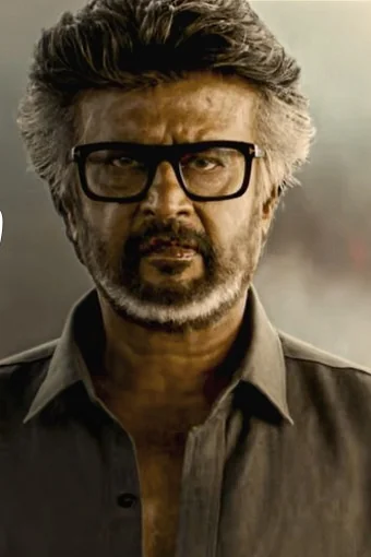 Rajinikanth as Muthuvel Pandian in Jailer 2, in glasses and a dark shirt against a smoky sky
