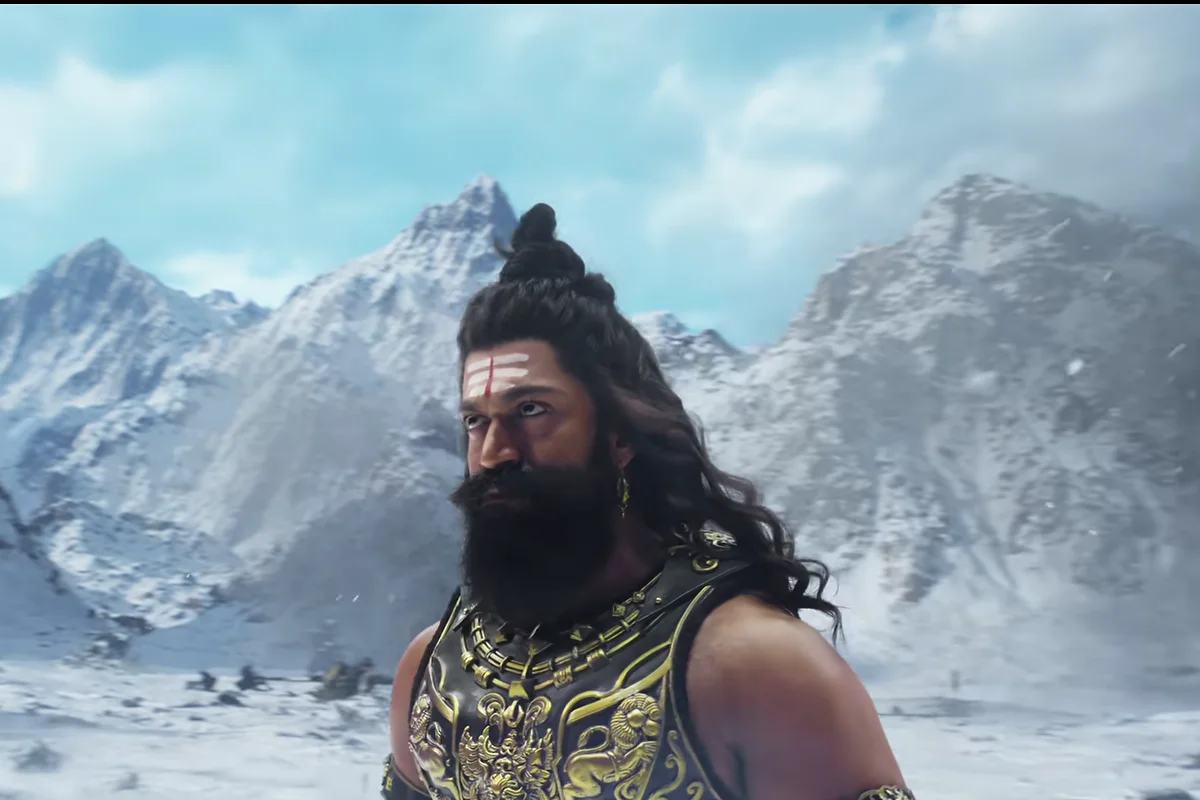 Yash as Ravana, bearded and in gold armour, standing in a snowy mountain valley